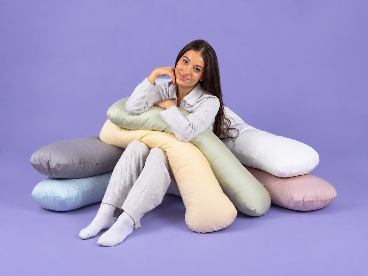 Woman hugging SleepCloud weighted body pillow